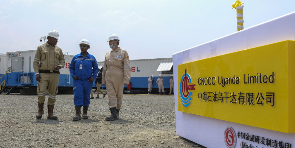 Ugandan and Chinese workers at an oil field in western Uganda