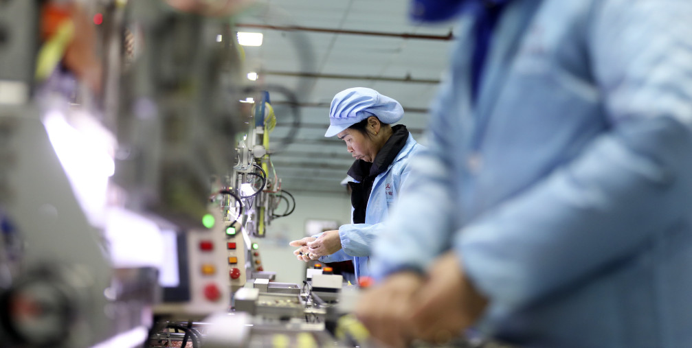 orkers work at an automated production workshop of Huihua Electronics Co LTD in Zixing Economic Development Zone, central China's Hunan province, Feb. 14, 2023.