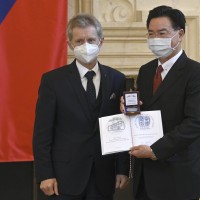 Czech Senate chairman Milos Vystrcil, left, handed Silver medal of Senate chairman to Taiwanese Foreign Affairs Minister Joseph Wu, right, on October 27, 2021, in Prague, Czech Republic.
